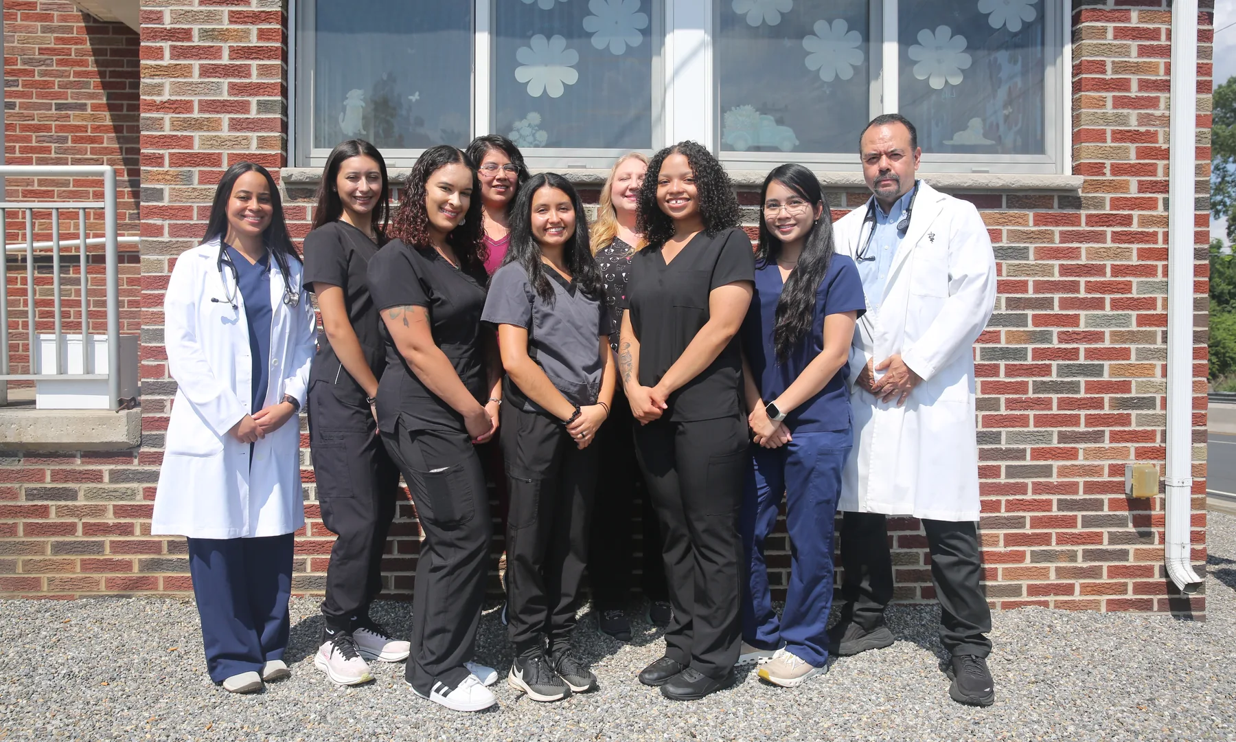 The Blue Cross team with the doctors outside the hospital at 470 McLean Blvd in Paterson